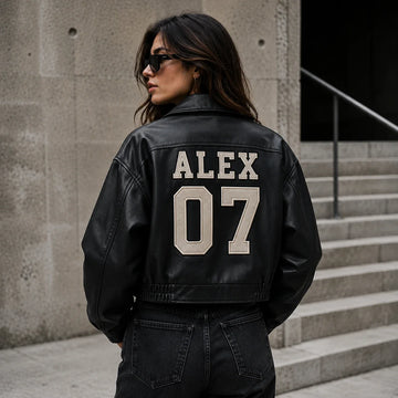 Woman wearing a black leather jacket with varsity-style ALEX 07 back lettering